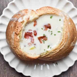 The New England Clam Chowder is in a bread bowl.