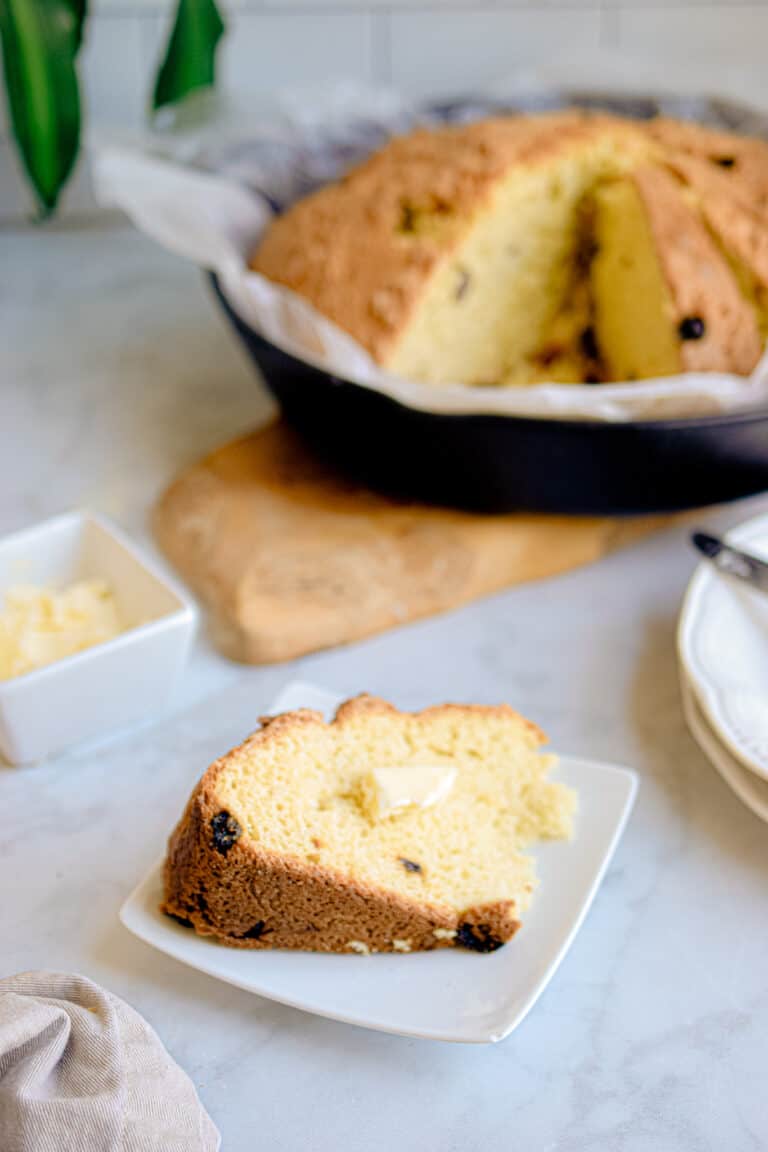 A slice of irish soda bread with butter on it