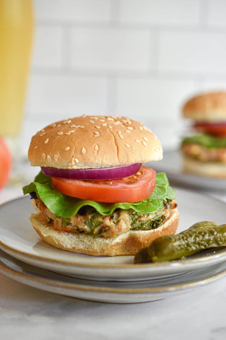 Chicken burgers with feta and spinach served with a beer