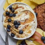 whipped feta dip with honey topped with honey and blueberries