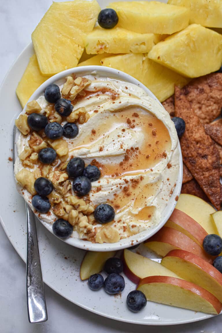 whipped feta dip with honey topped with honey and blueberries