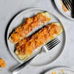 Two Buffalo Chicken Stuffed Zucchini are on a plate
