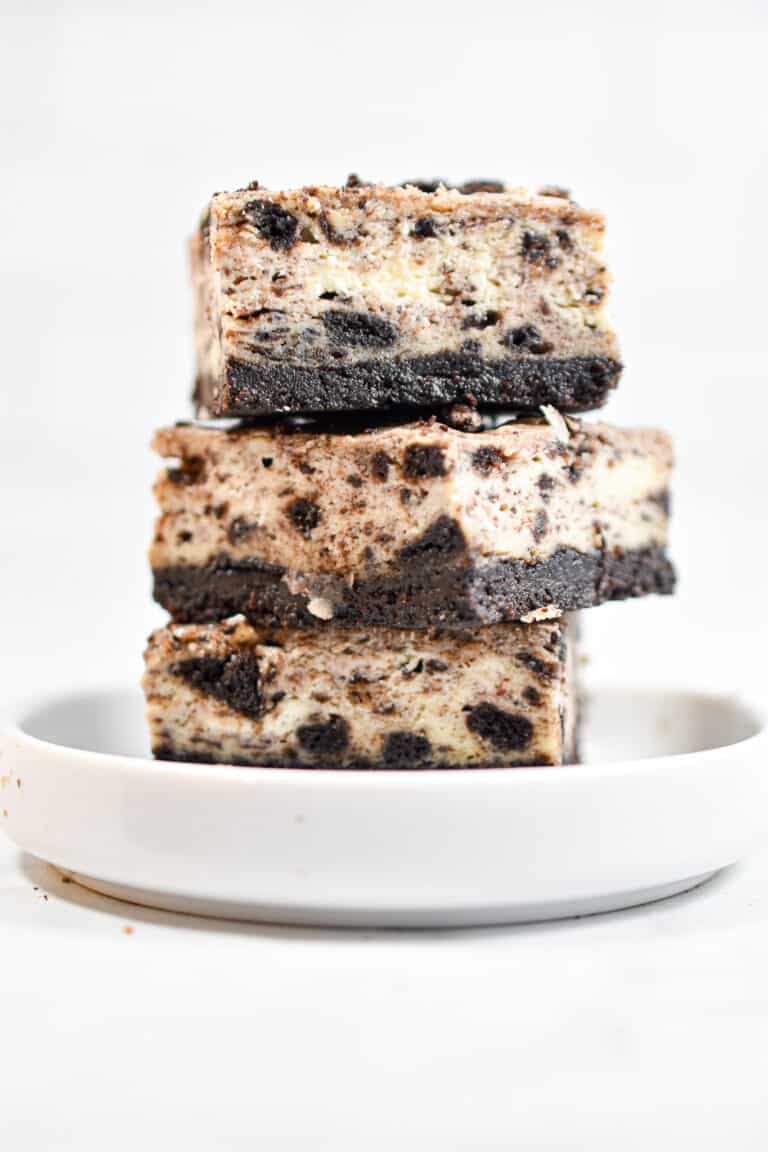 Three Oreo Cheesecake Bars are stacked