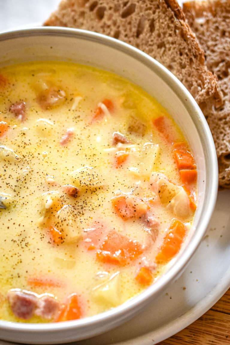 A close up of the Instant Pot Ham and potato soup with no spoon in the bowl