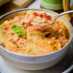 A spoonful of the lasagna soup is lifted from the bowl