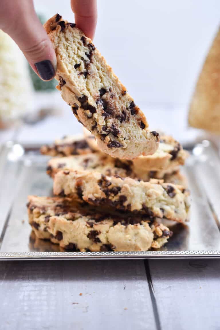 A hand is picking up one sourdough biscotti