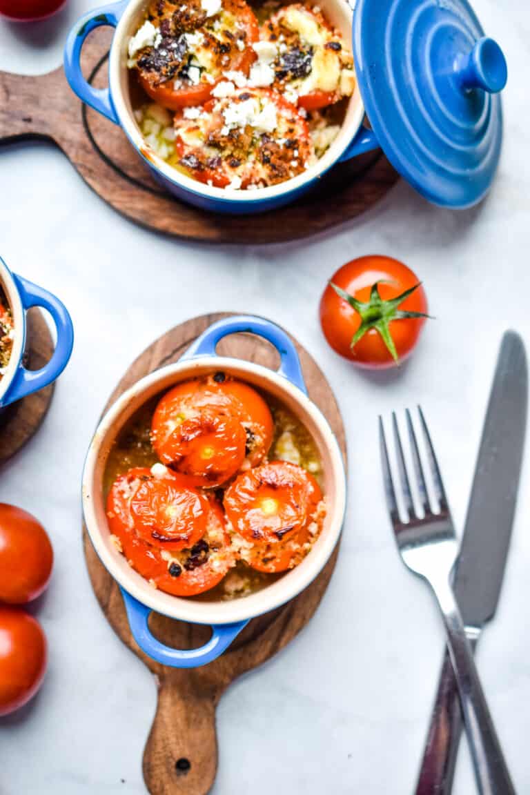 Two ramekins are full of tomatoes
