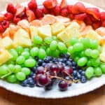 The rainbow fruit platter is done and on an oval platter.
