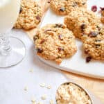 A glass of milk and the oatmeal craisin cookies.