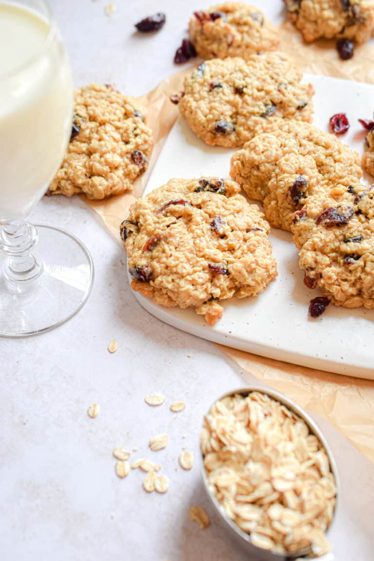 A glass of milk and the oatmeal craisin cookies.