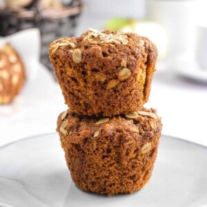 Two muffins are stacked on top of each other.