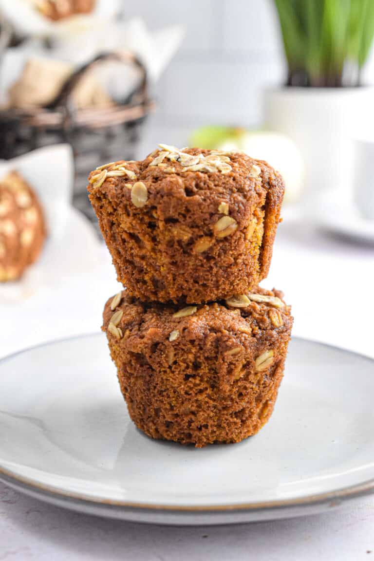 Two muffins are stacked on top of each other.
