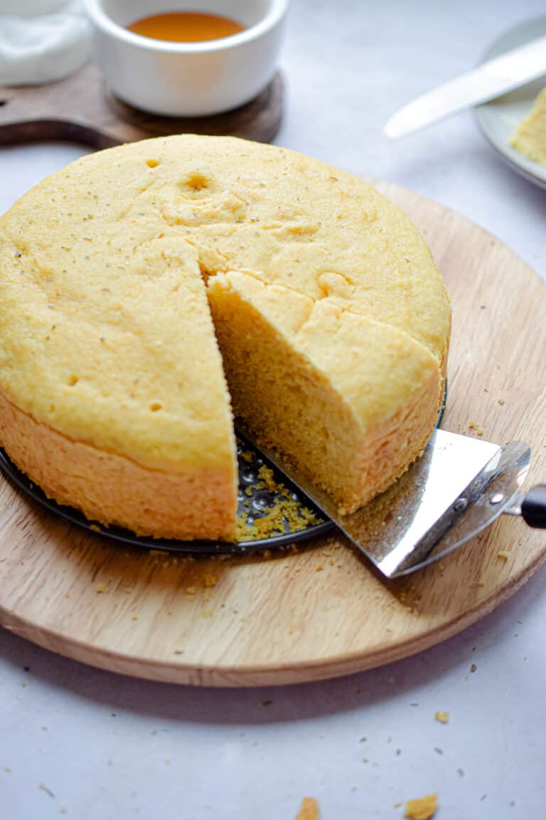 A pie server is taking a piece of the Instant Pot Cornbread.
