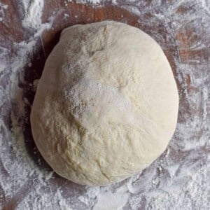 The dough is on a floured surface.
