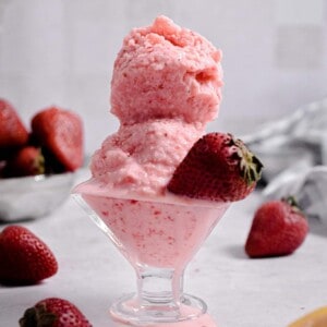 Two scoops of ice cream are in a bowl.