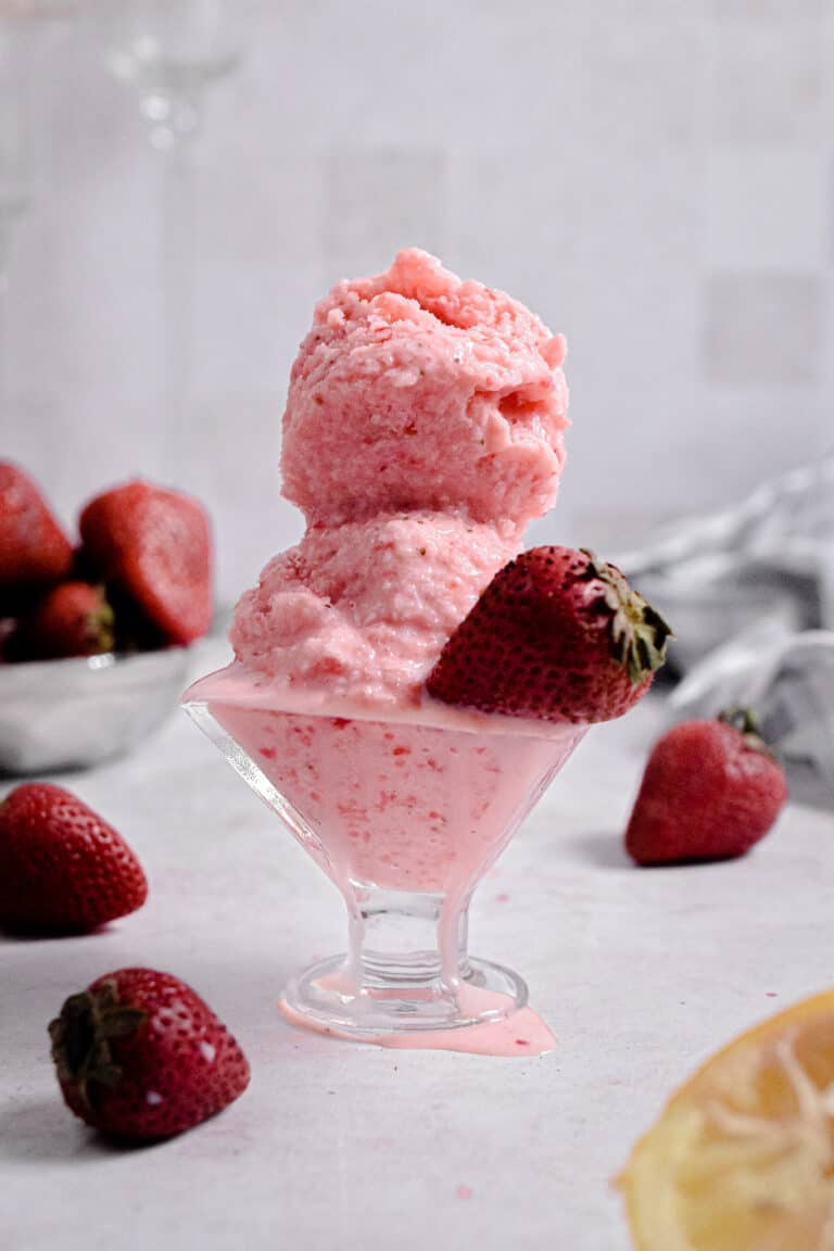 Two scoops of ice cream are in a bowl.