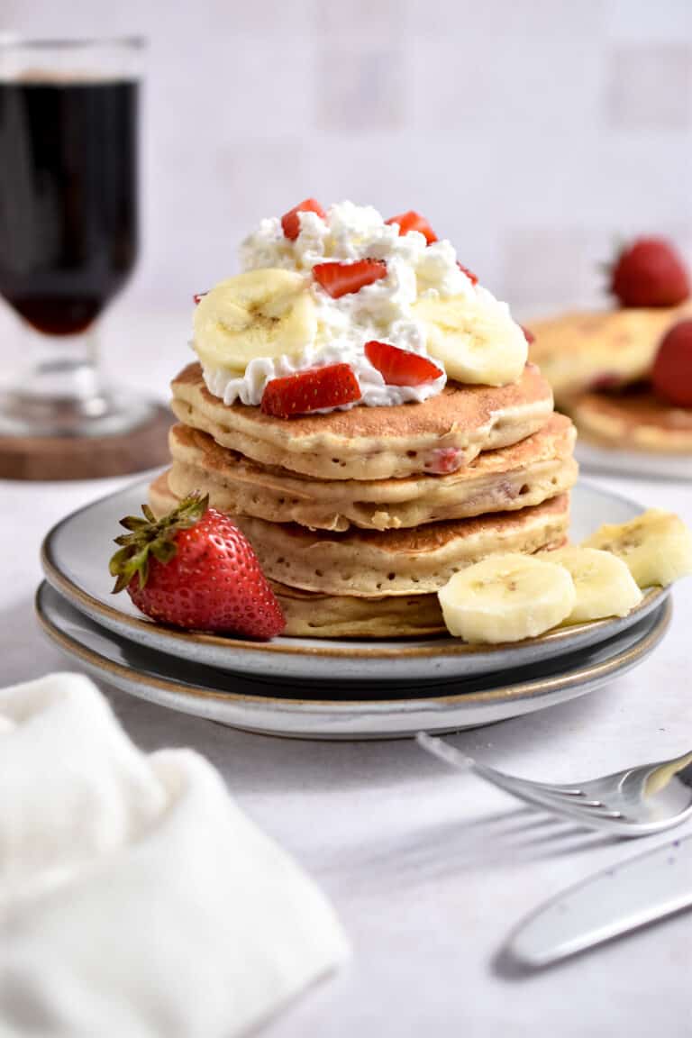 A straight on shot of the strawberry banana pancakes
