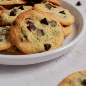 The plate of cookies with self rising flour is set out with cookies in the background.