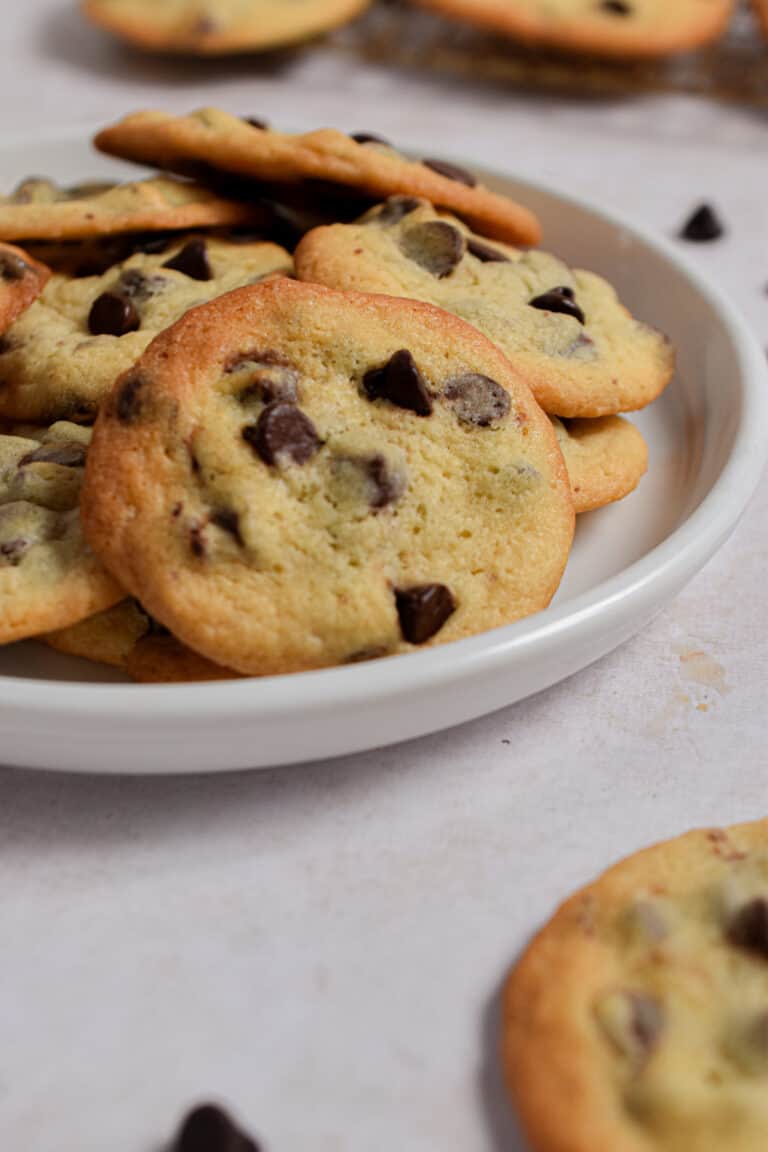 The plate of cookies with self rising flour is set out with cookies in the background.