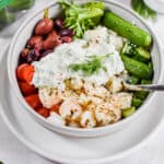 A sprig of dill garnishes the shrimp bowl.