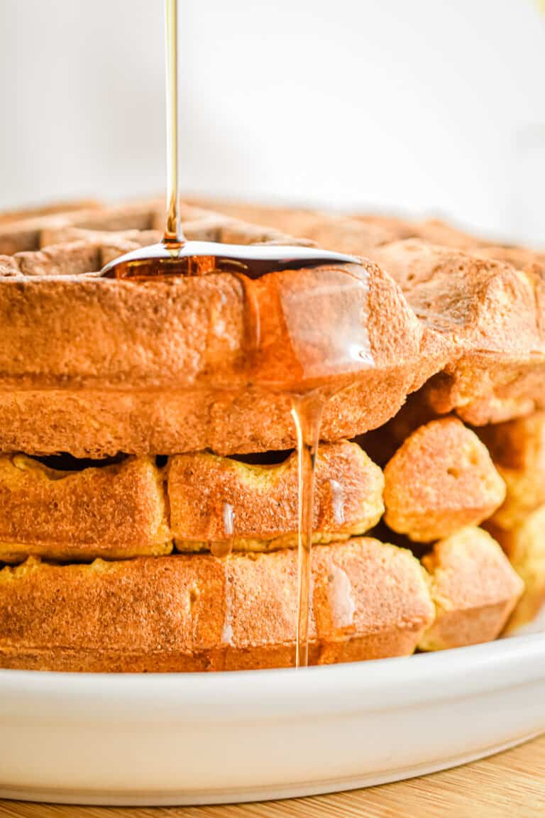 Maple syrup is dripping off the pumpkin waffles.