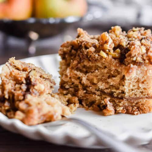 A close up of a slice of cake and a piece on the fork.