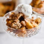 A close up of the bread pudding in a glass.