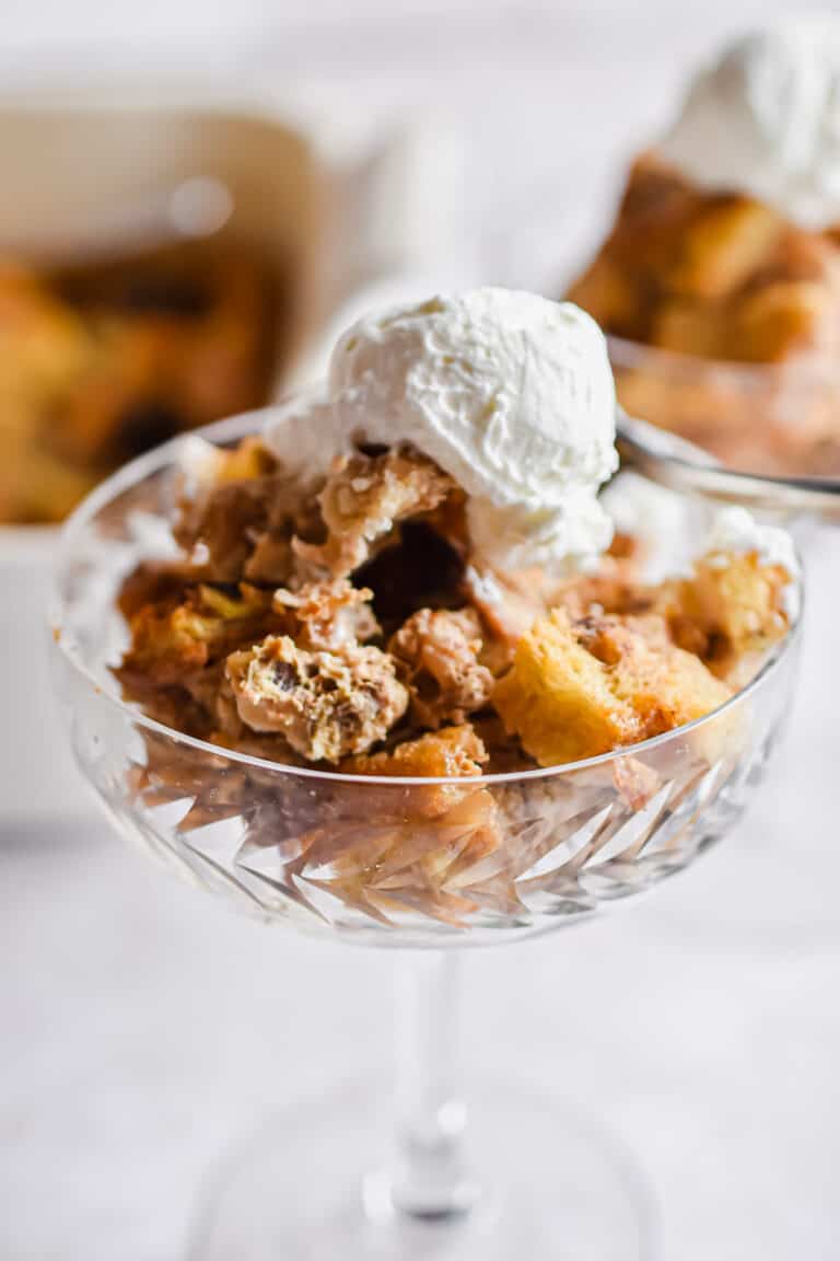 A close up of the bread pudding in a glass.