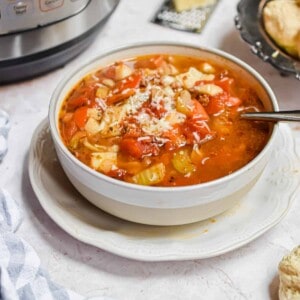 The soup is in front of the Instant Pot.