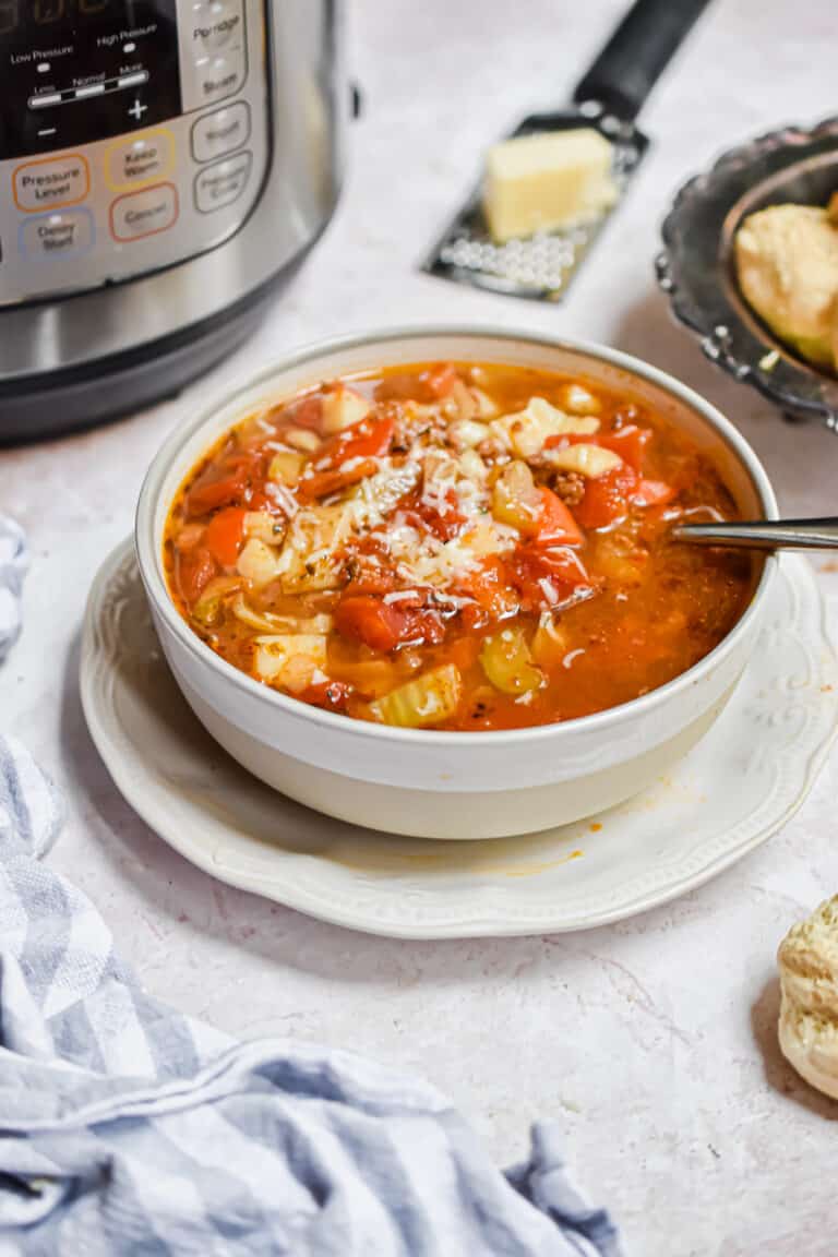 The soup is in front of the Instant Pot.