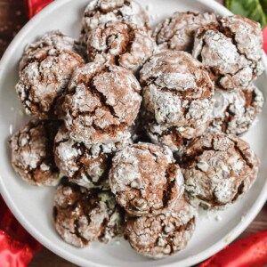 A cookie plate is surrounded by red ribbon.