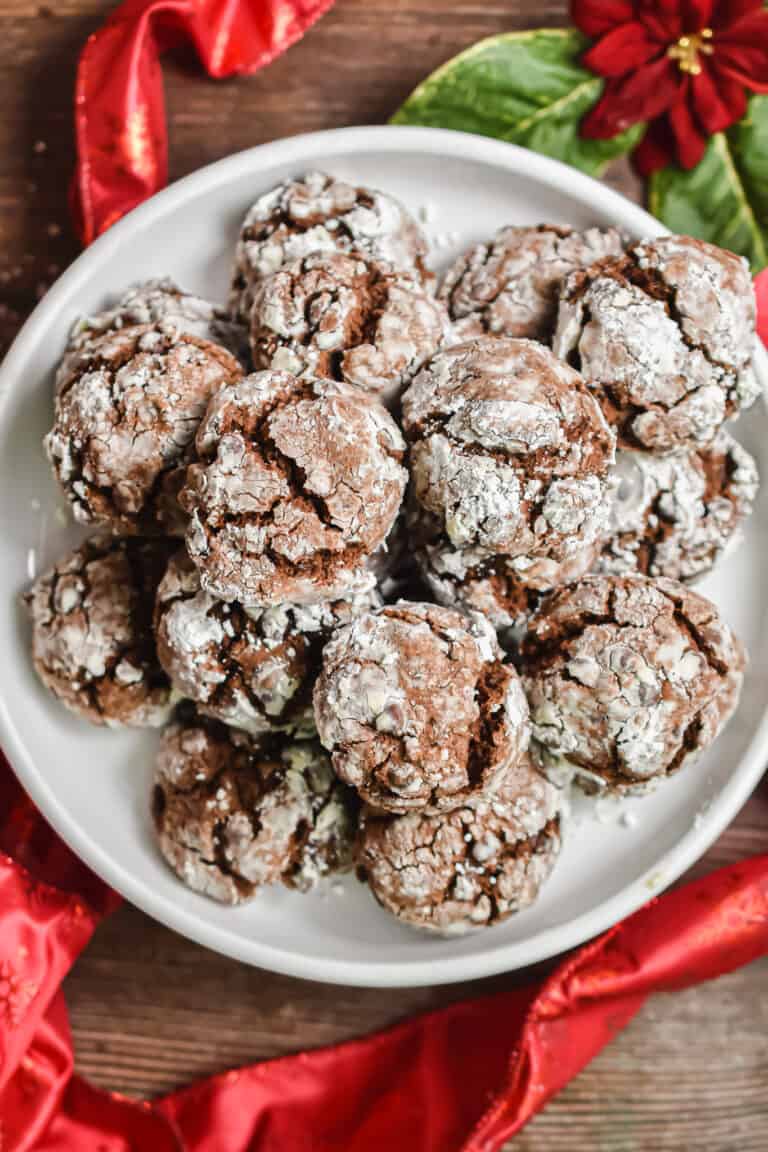 A cookie plate is surrounded by red ribbon.