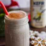 The gingerbread kefir smoothie is in front of the bottle of kefir.