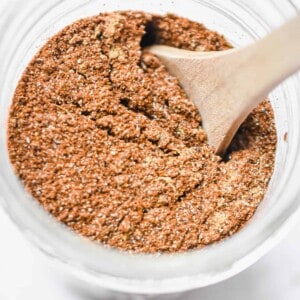 A wooden spoon is in the mason jar.