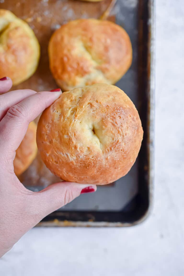 A hand is holding one of the 5 ingredient bagels