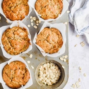 An overhead shot of the muffins in a muffin tin.