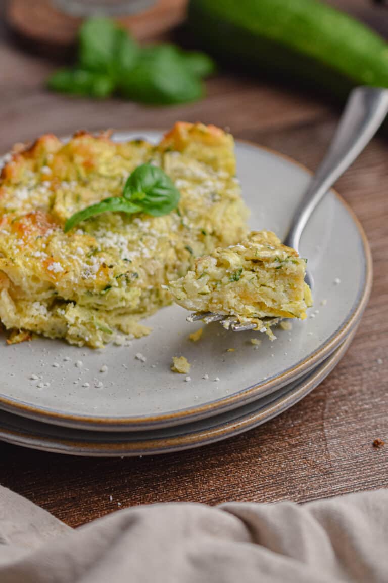A piece of the zucchini casserole with bisquick is on a fork.