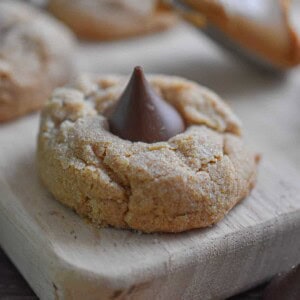 3-ingredient peanut butter blossom is on a cutting board.