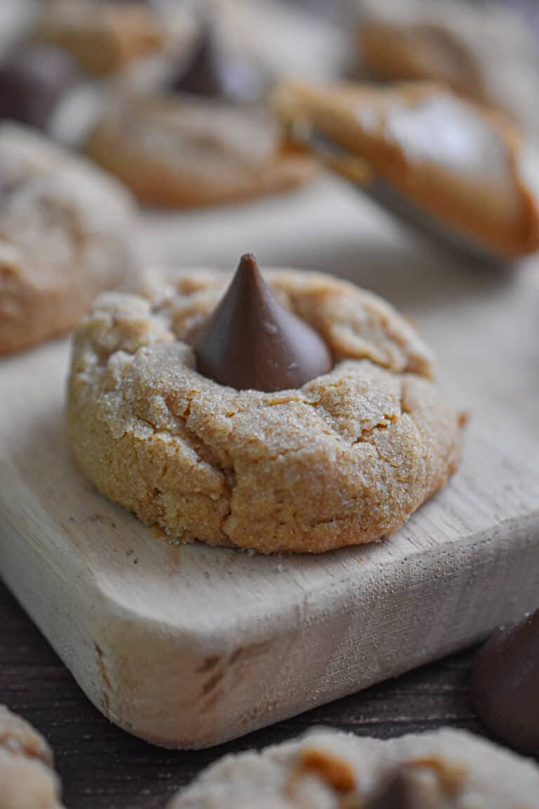 3-ingredient peanut butter blossom is on a cutting board.
