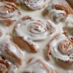 The glaze is poured onto the Bisquick cinnamon rolls.