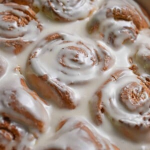 The glaze is poured onto the Bisquick cinnamon rolls.