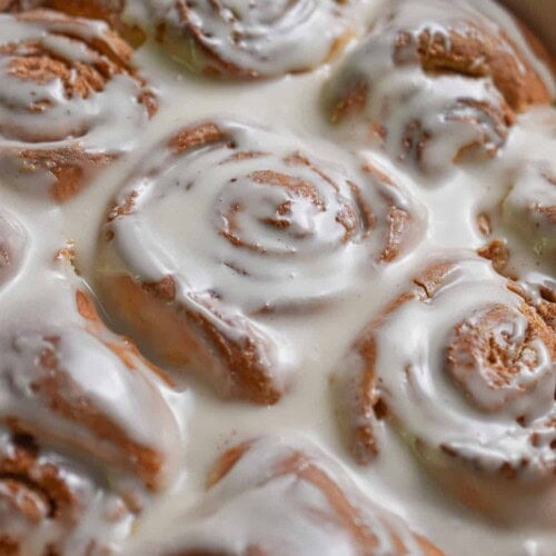 The glaze is poured onto the Bisquick cinnamon rolls.
