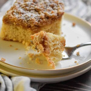 A piece of the Bisquick coffee cake in a 9x13 inch pan is on a fork.