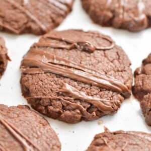 A 3-Ingredient Nutella Cookie is shown being surrounded by six other cookies.