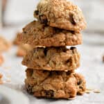 Four oatmeal cookies with self rising flour are stacked.