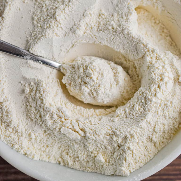 A spoon is in a bowl with the homemade Bisquick.