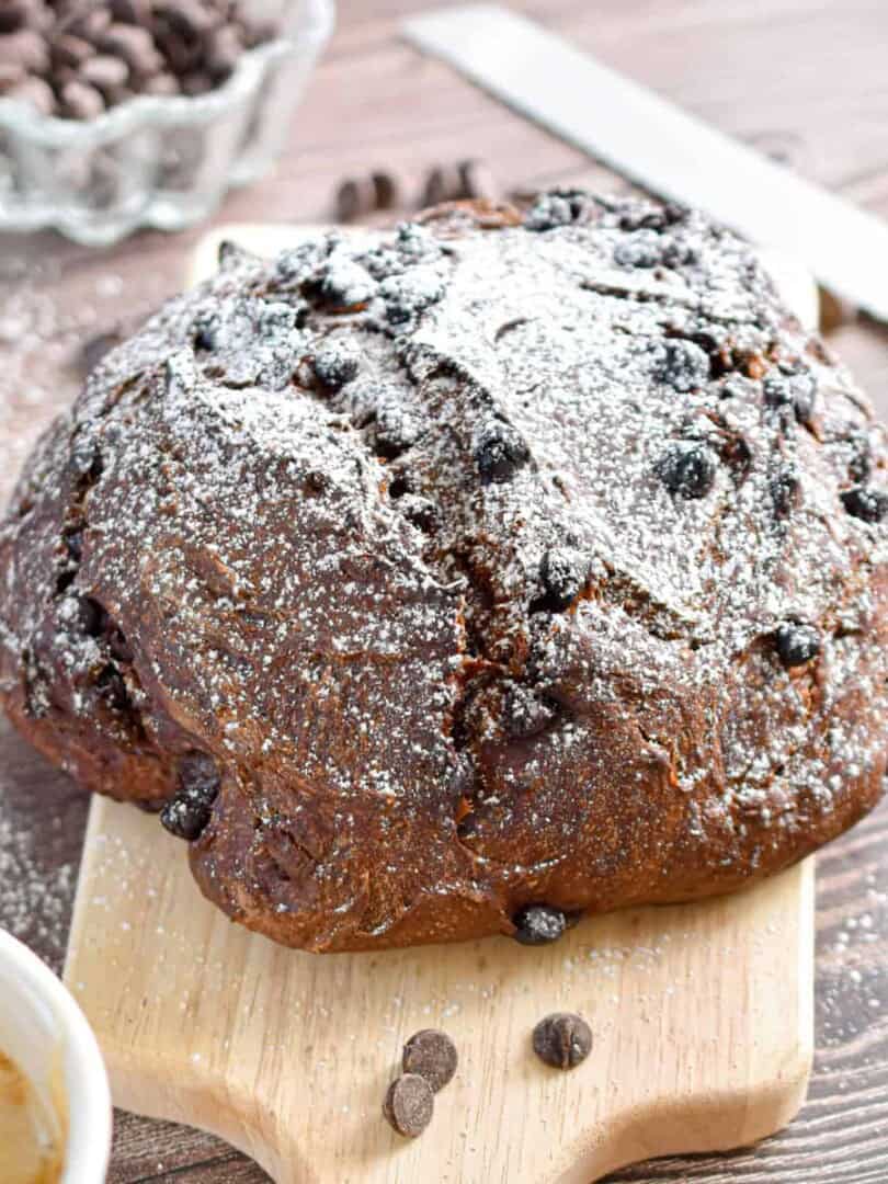 The double chocolate sourdough bread is sprinkled with powdered sugar.