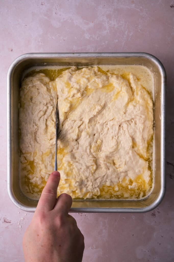 The biscuit dough are added to the butter pan.
