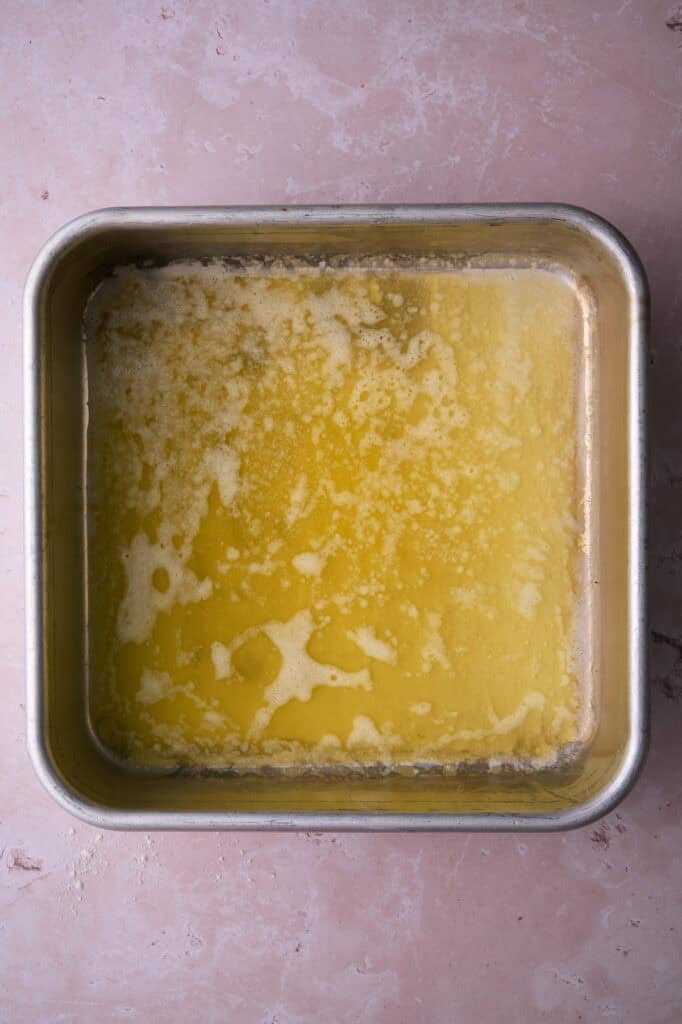 The butter is added to the baking dish.