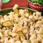 Chopped pickles are added to the top of the dill pickle pasta salad.